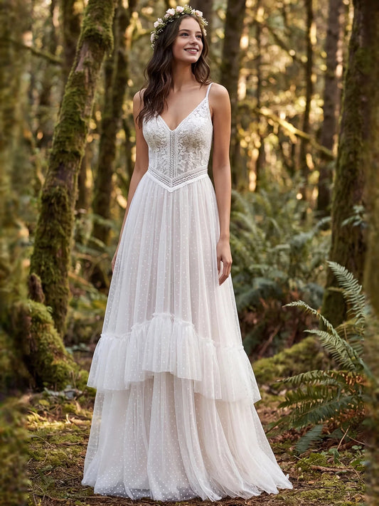 Ivory floor-length wedding dress, front view showing the a-line silhouette