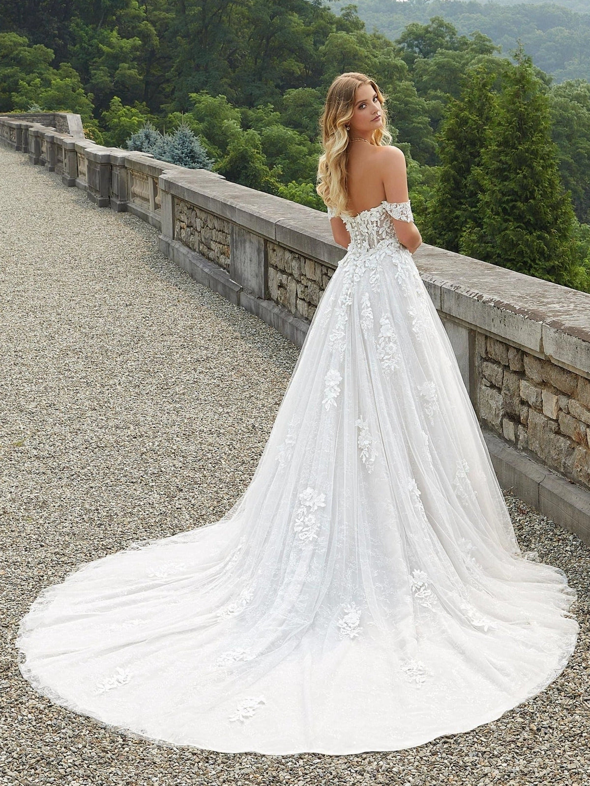 Ivory floor-length wedding dress, front view showing the a-line silhouette