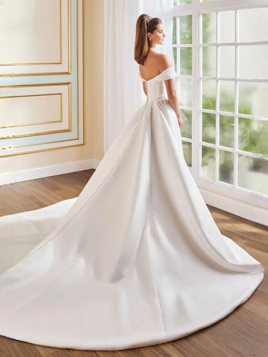 Ivory floor-length wedding dress, front view showing the a-line silhouette