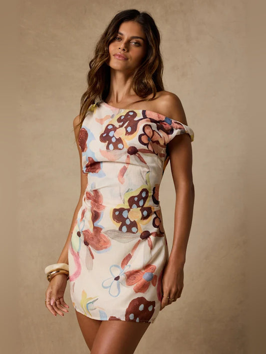 Floral mini homecoming dress, front view showing the asymmetrical silhouette