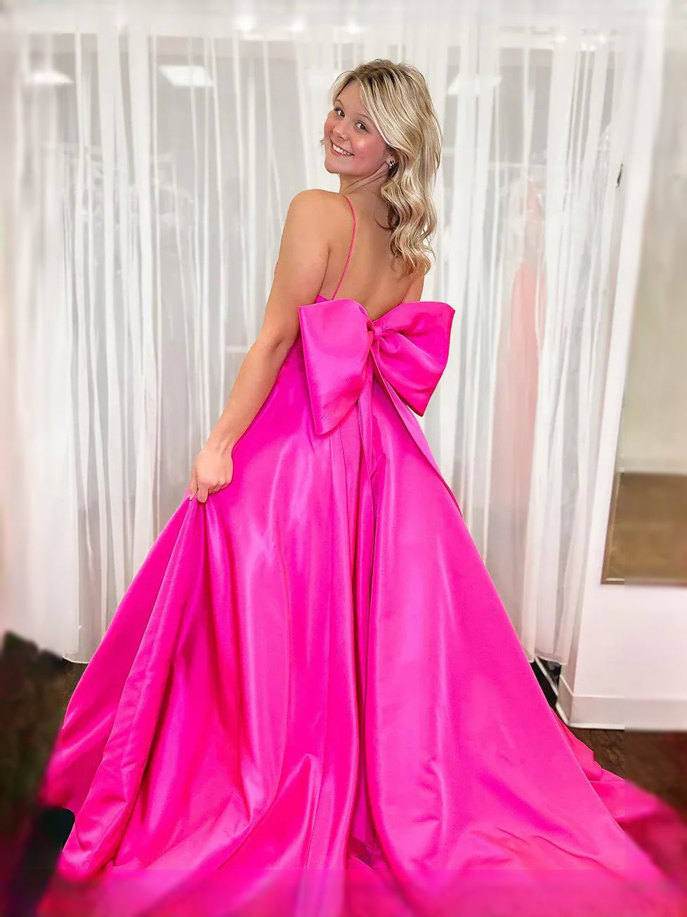 Fuchsia floor-length prom dress, front view showing the a-line silhouette
