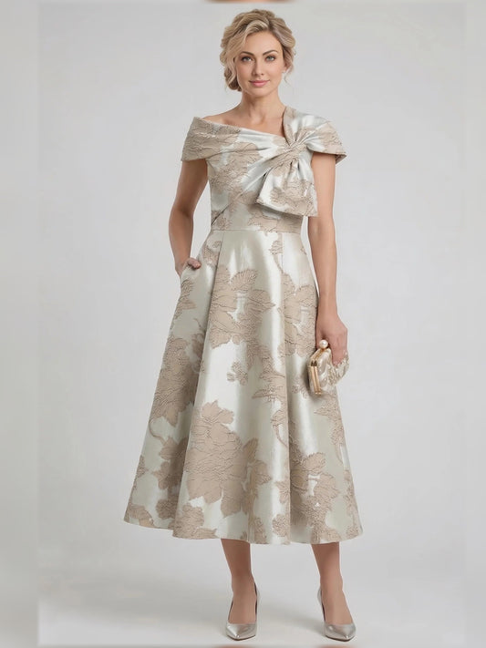 Champagne tea-length mother of the bride dress, front view showing the a-line silhouette