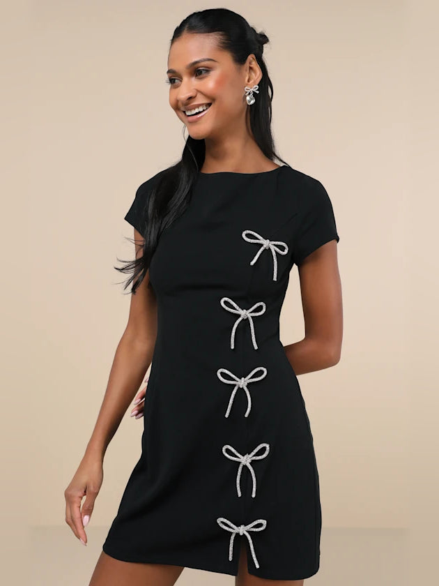 Black mini homecoming dress, front view showing the silhouette