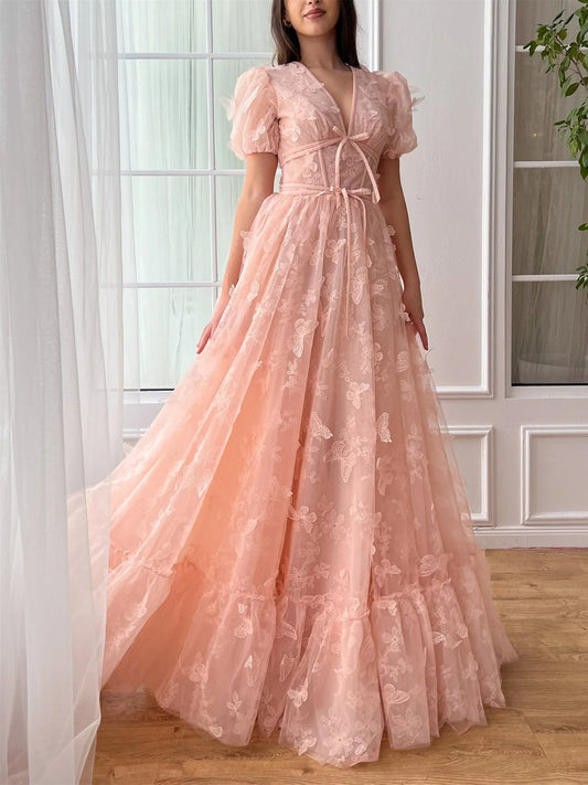 Peach floor-length prom dress, front view showing the a-line silhouette