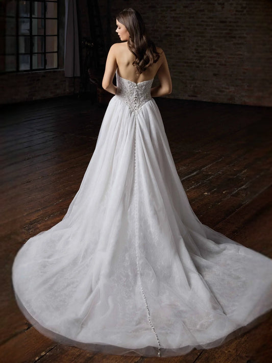 Ivory floor-length wedding dress, front view showing the a-line silhouette