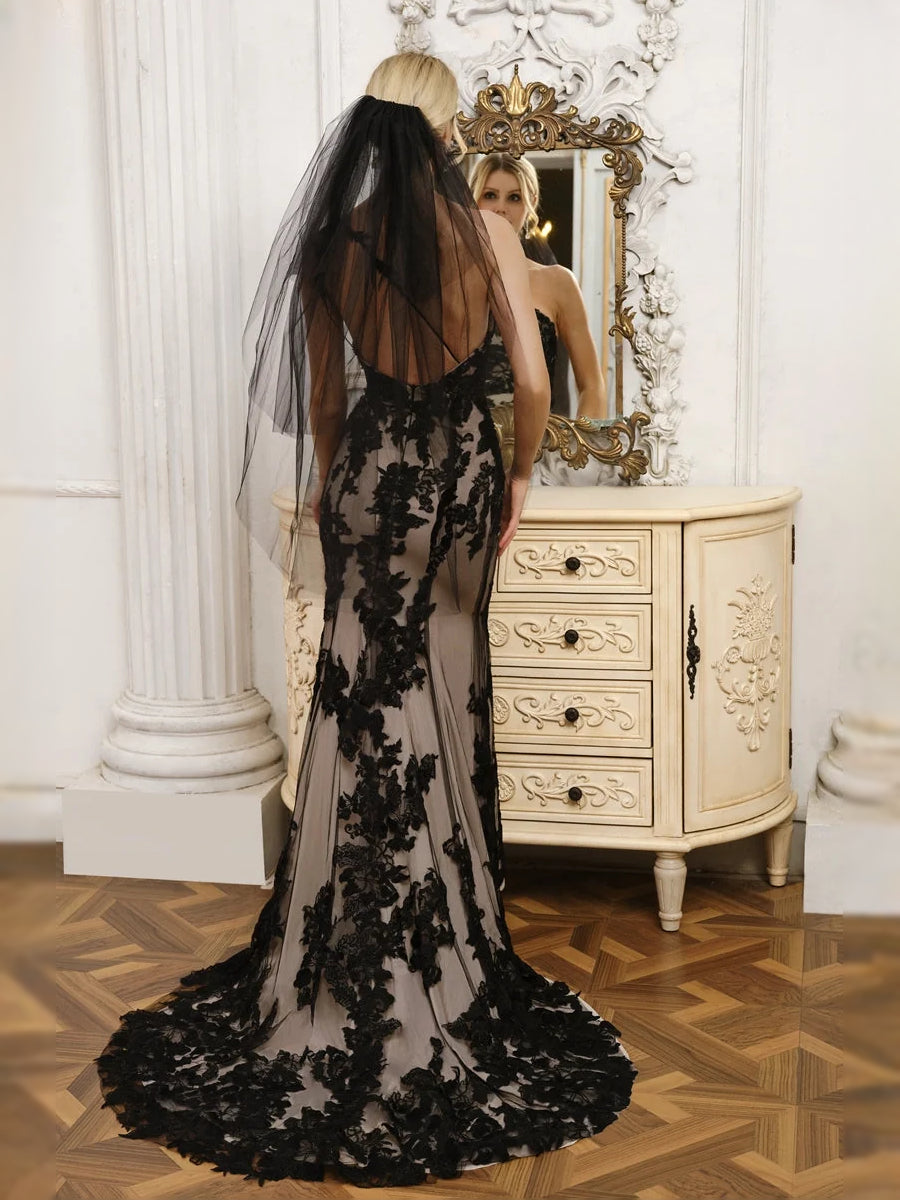 Black floor-length wedding dress, front view showing the mermaid silhouette
