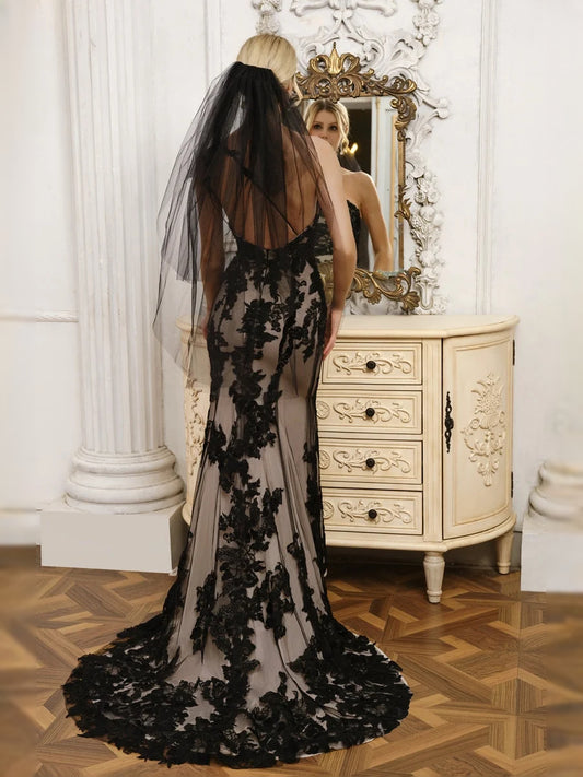 Black floor-length wedding dress, front view showing the mermaid silhouette