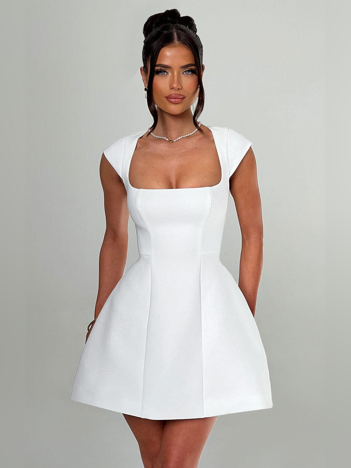 Ivory mini homecoming dress, front view showing the a-line silhouette