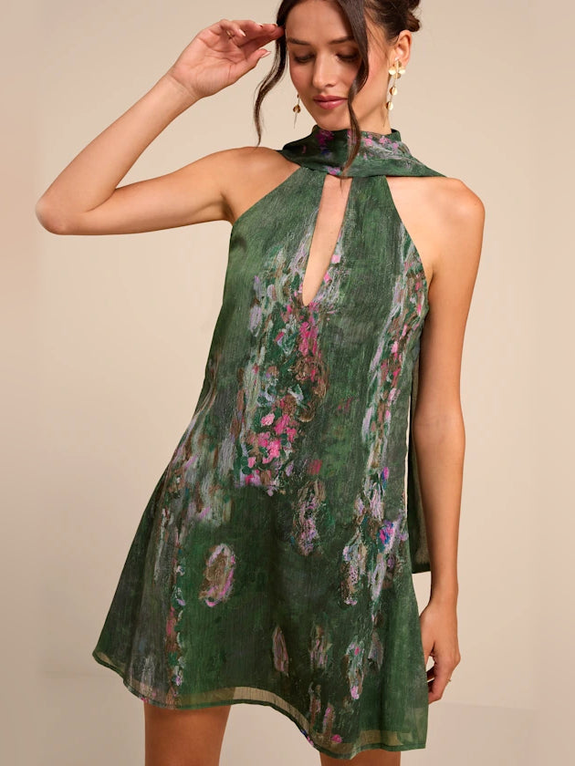 Green mini homecoming dress, front view showing the a-line silhouette