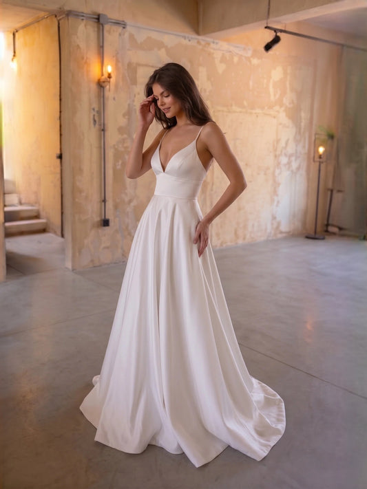 Ivory floor-length wedding dress, front view showing the a-line silhouette