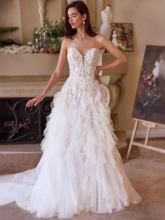 Ivory floor-length wedding dress, front view showing the a-line silhouette