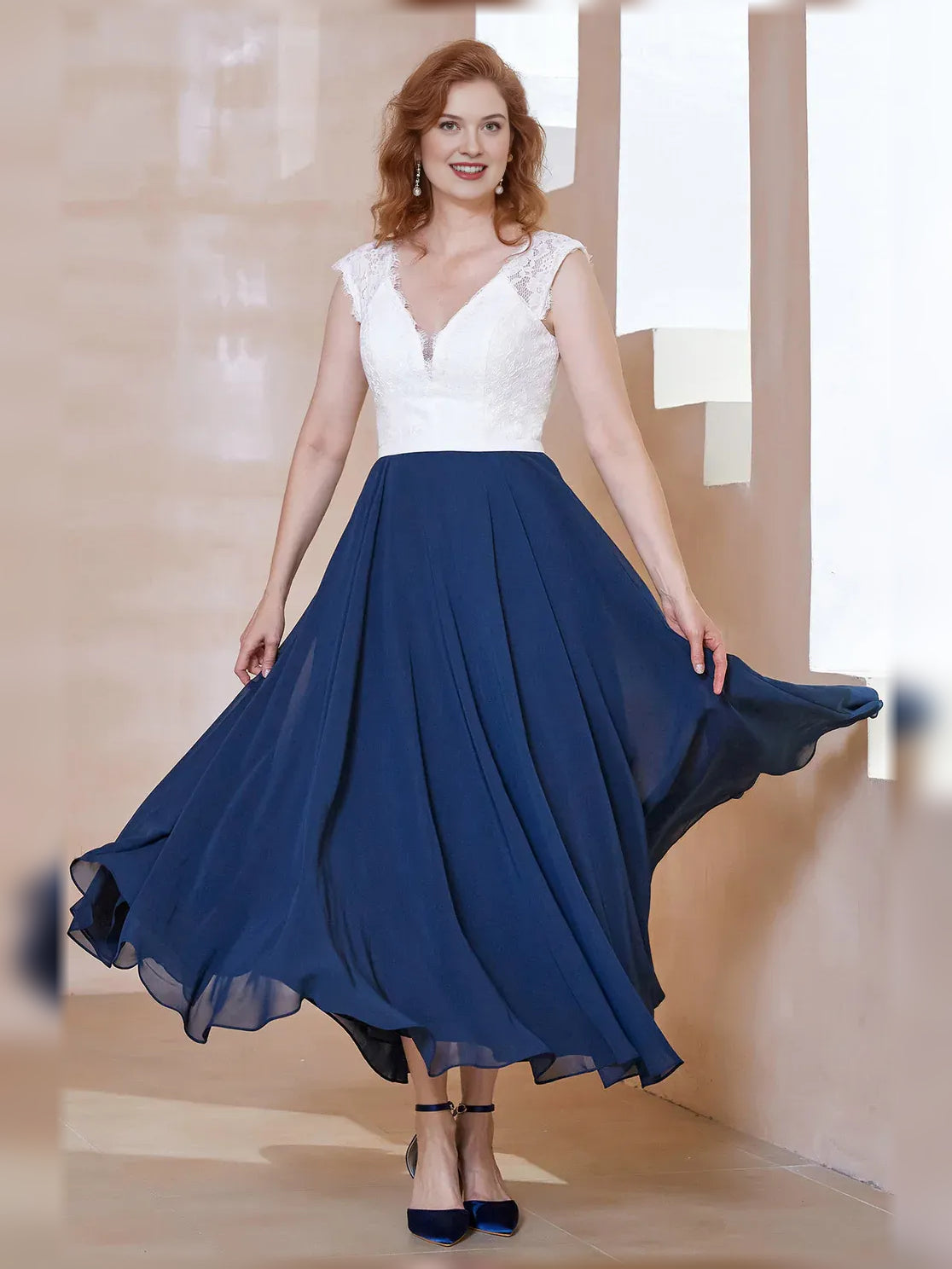 Navy Blue midi mother of the bride dress, front view showing the a-line silhouette