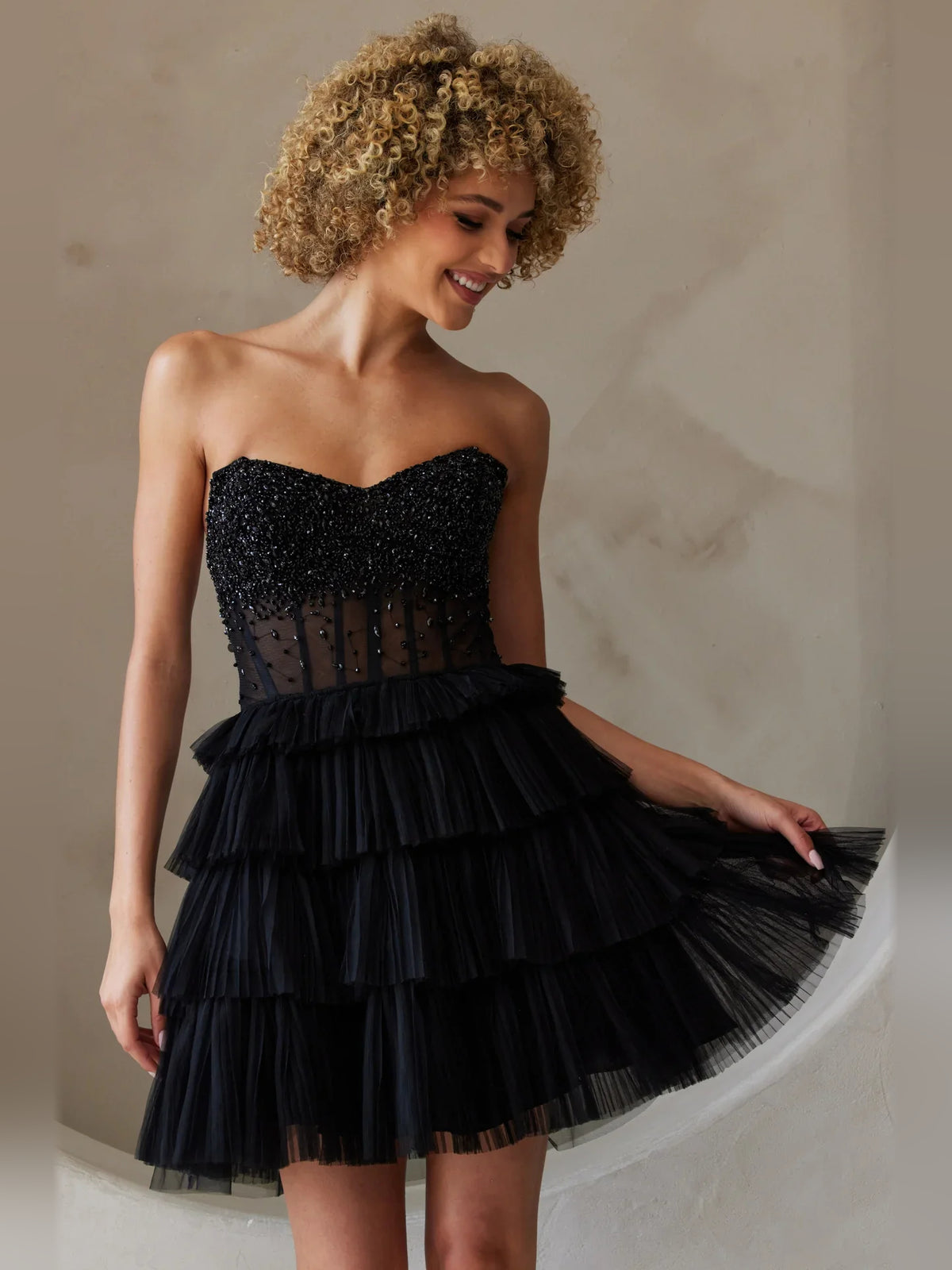 Black mini homecoming dress, alternate view showing the full-length silhouette