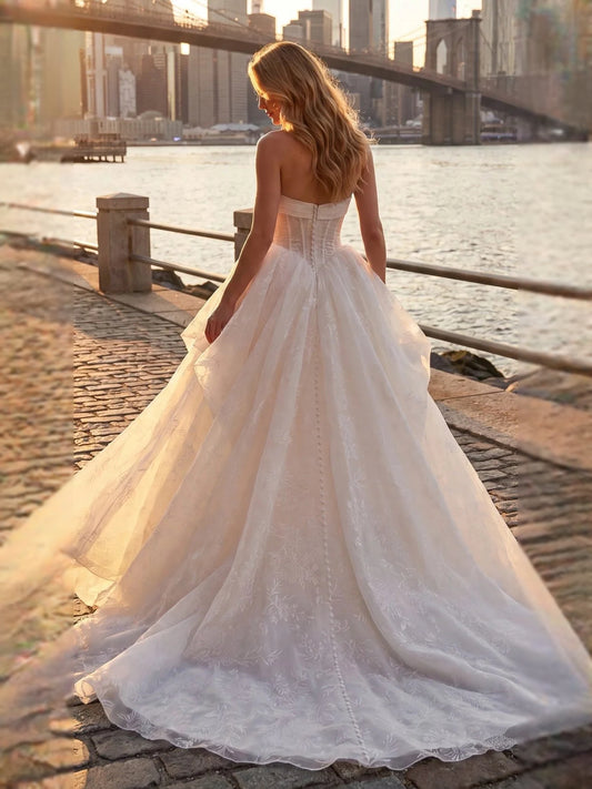 Ivory floor-length wedding dress, front view showing the ball-gown silhouette