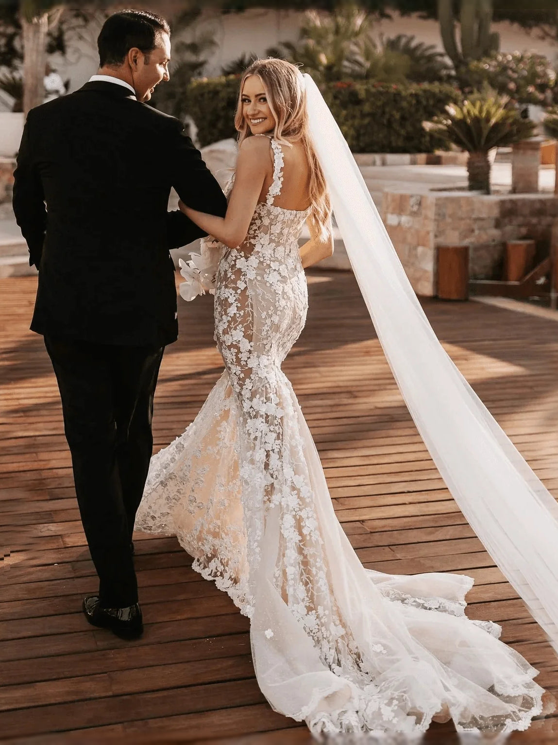 Ivory floor-length wedding dress, front view showing the mermaid silhouette