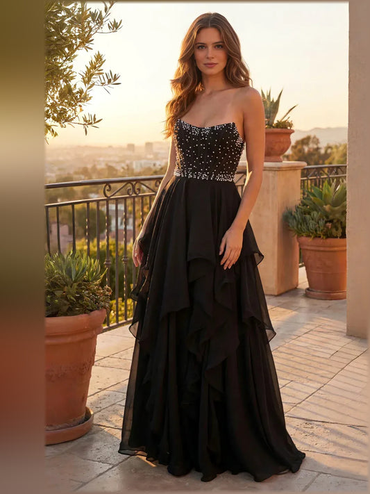 Black floor-length formal dress with strapless neckline, full-length front view