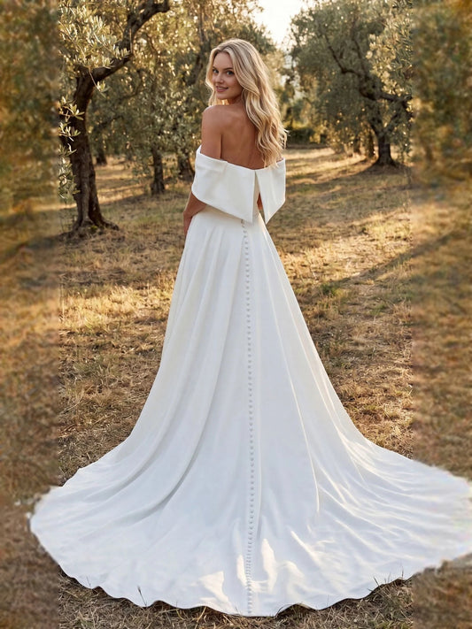Ivory floor-length wedding dress, front view showing the a-line silhouette