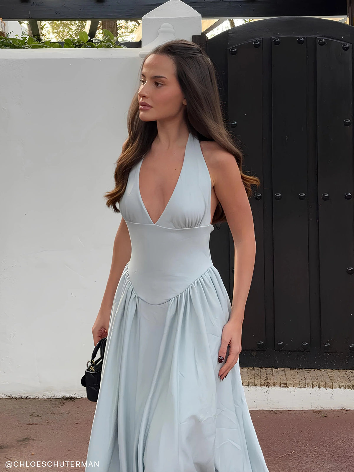 Blue midi formal dress with halter neckline, full-length front view