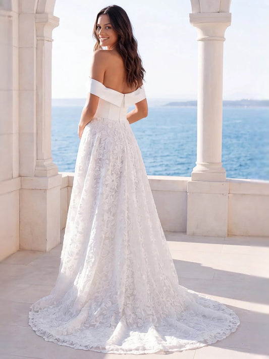 Ivory floor-length wedding dress, front view showing the a-line silhouette