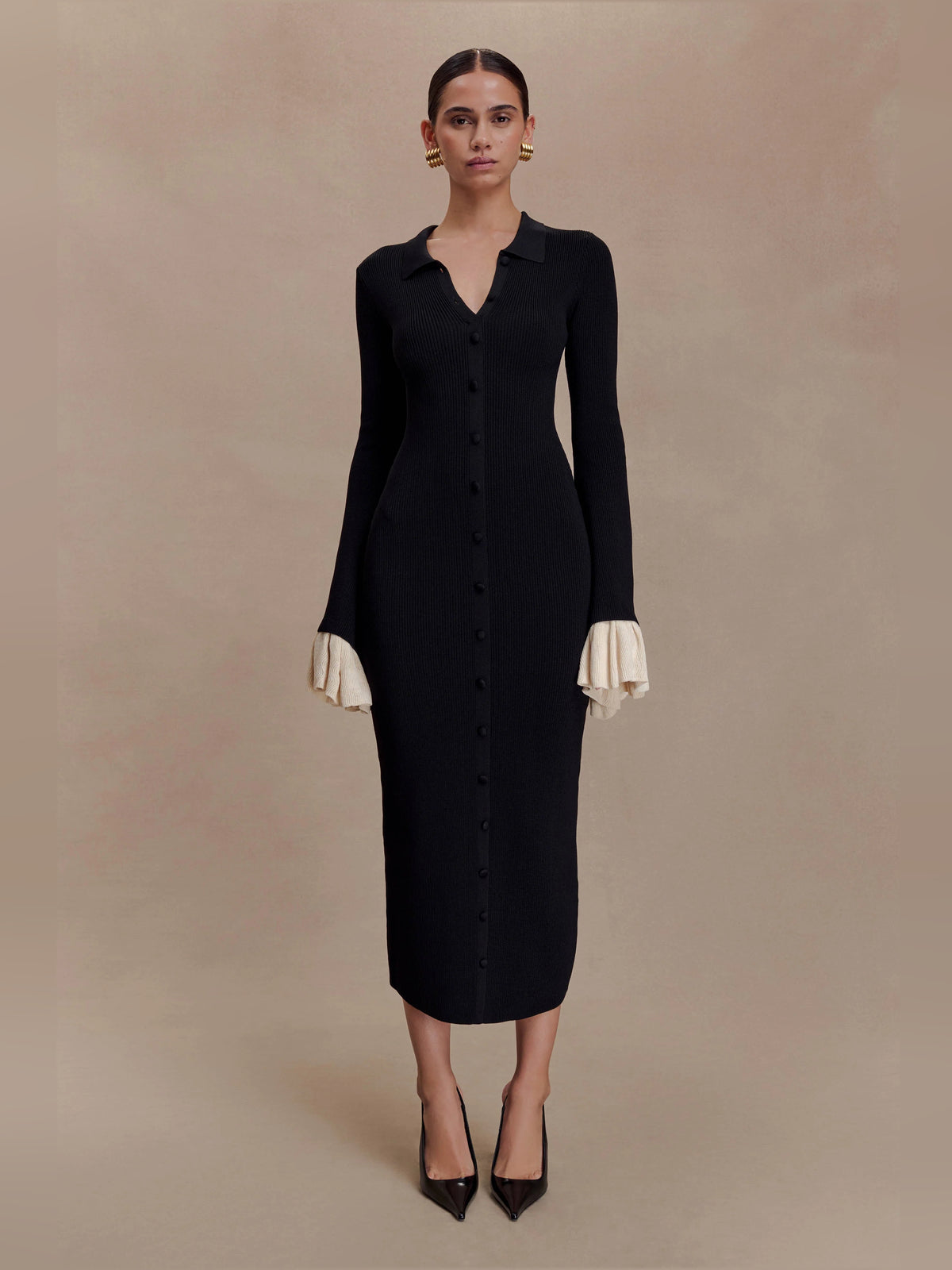 Black midi formal dress with ruffle details, full-length front view