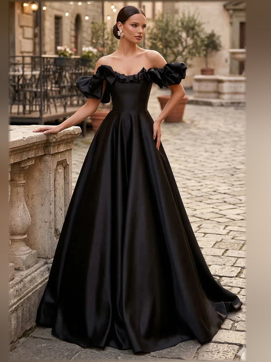 Black a-line floor-length formal dress with off-the-shoulder neckline, full-length front view