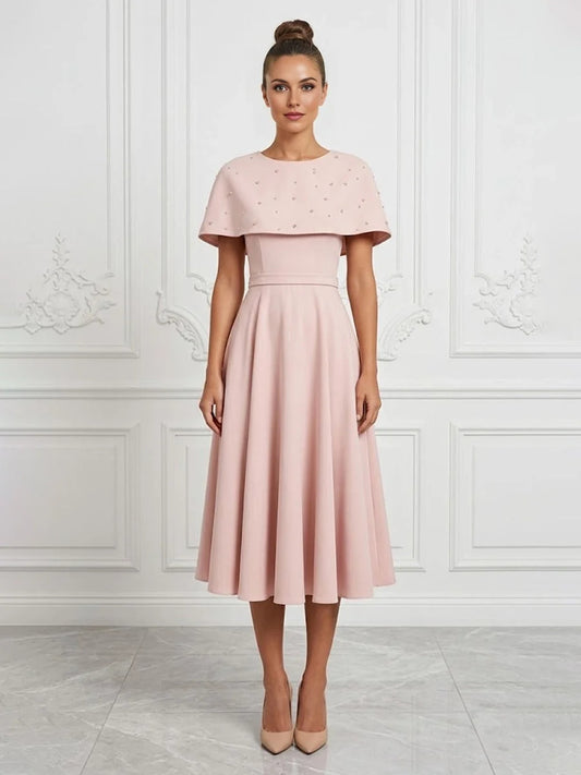 Blush Pink midi mother of the bride dress, front view showing the a-line silhouette