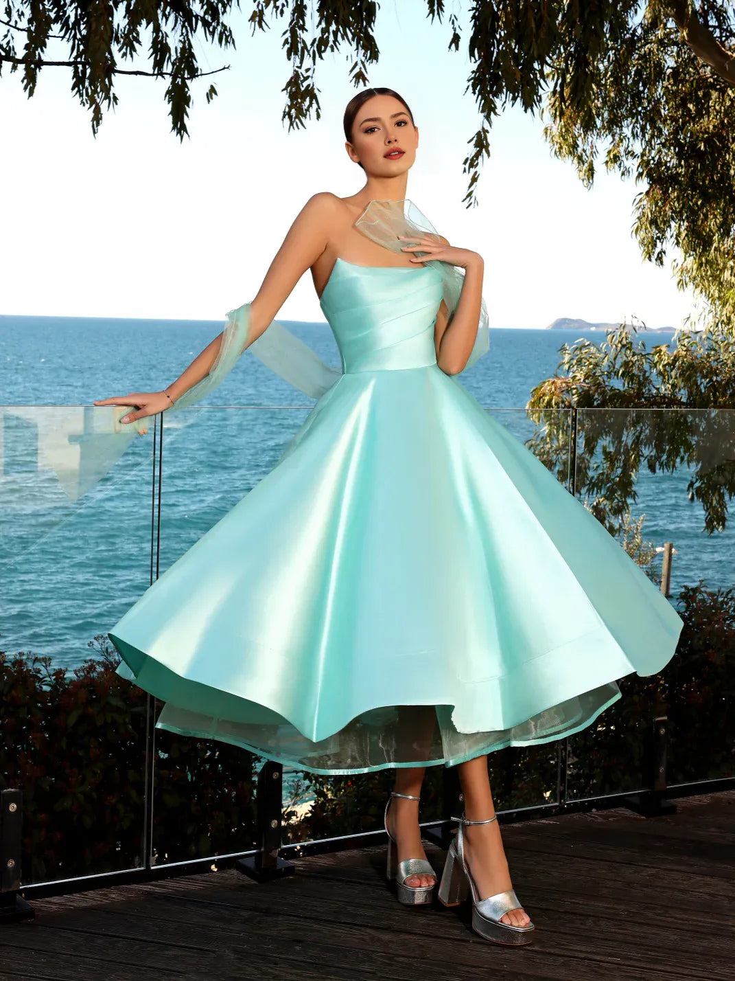 Ice Blue tea-length prom dress, front view showing the a-line silhouette