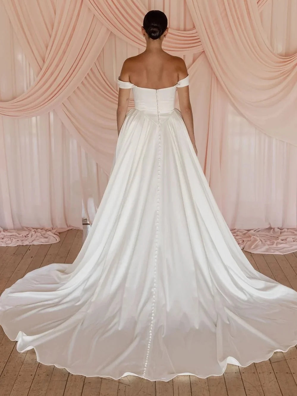 Ivory floor-length wedding dress, front view showing the ball-gown silhouette