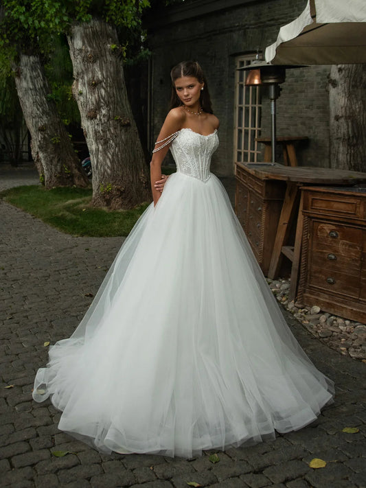 Ivory floor-length wedding dress, front view showing the ball-gown silhouette