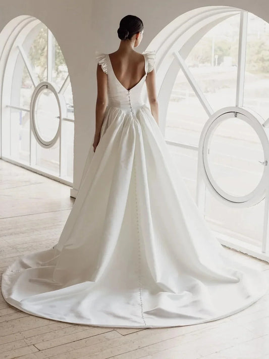 Ivory floor-length wedding dress, front view showing the ball-gown silhouette