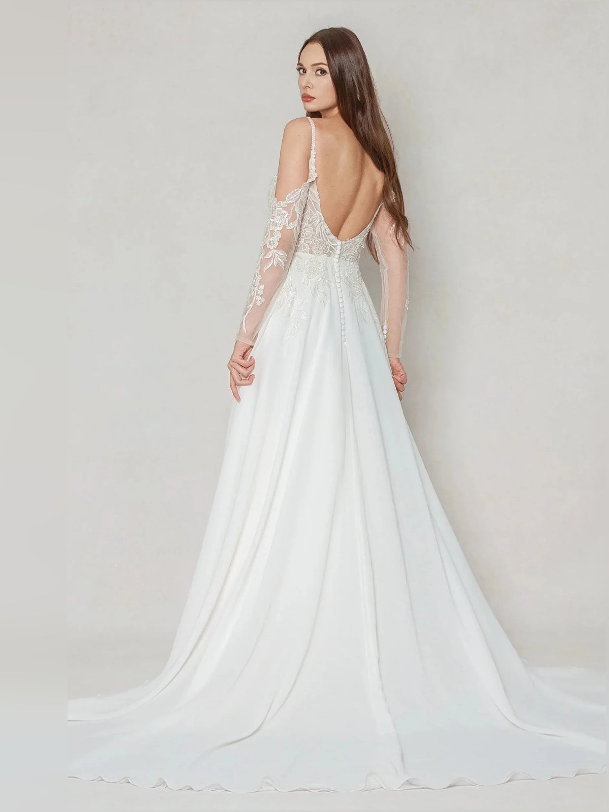 Ivory floor-length wedding dress, front view showing the a-line silhouette