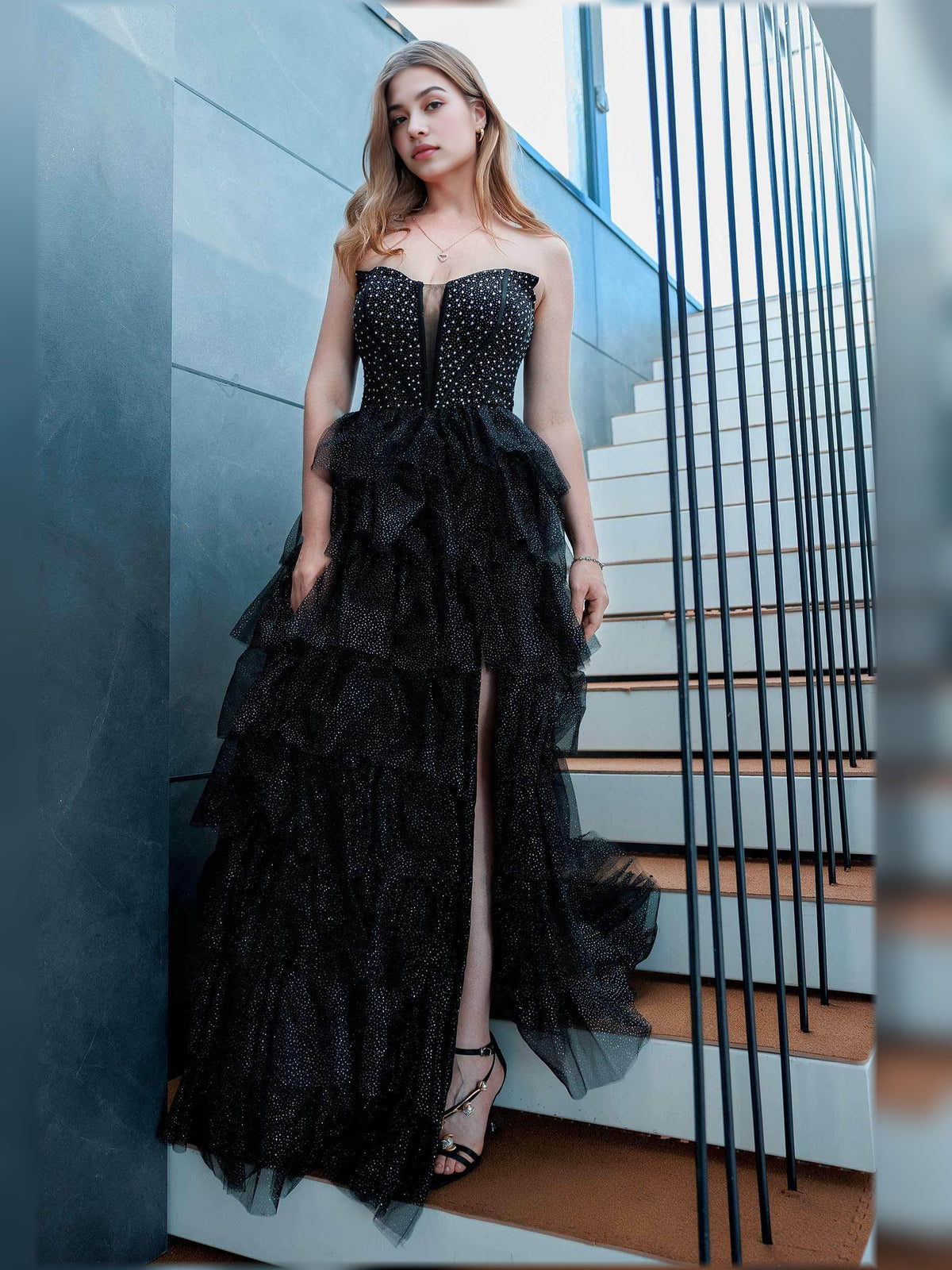Black a-line floor-length formal dress with V-neckline, full-length front view