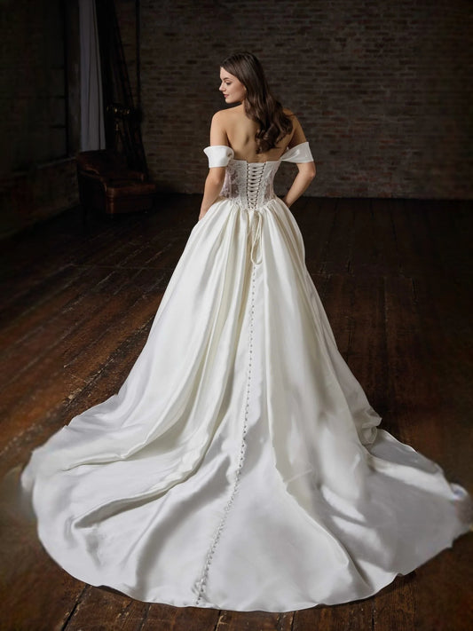 Ivory floor-length wedding dress, front view showing the ball-gown silhouette