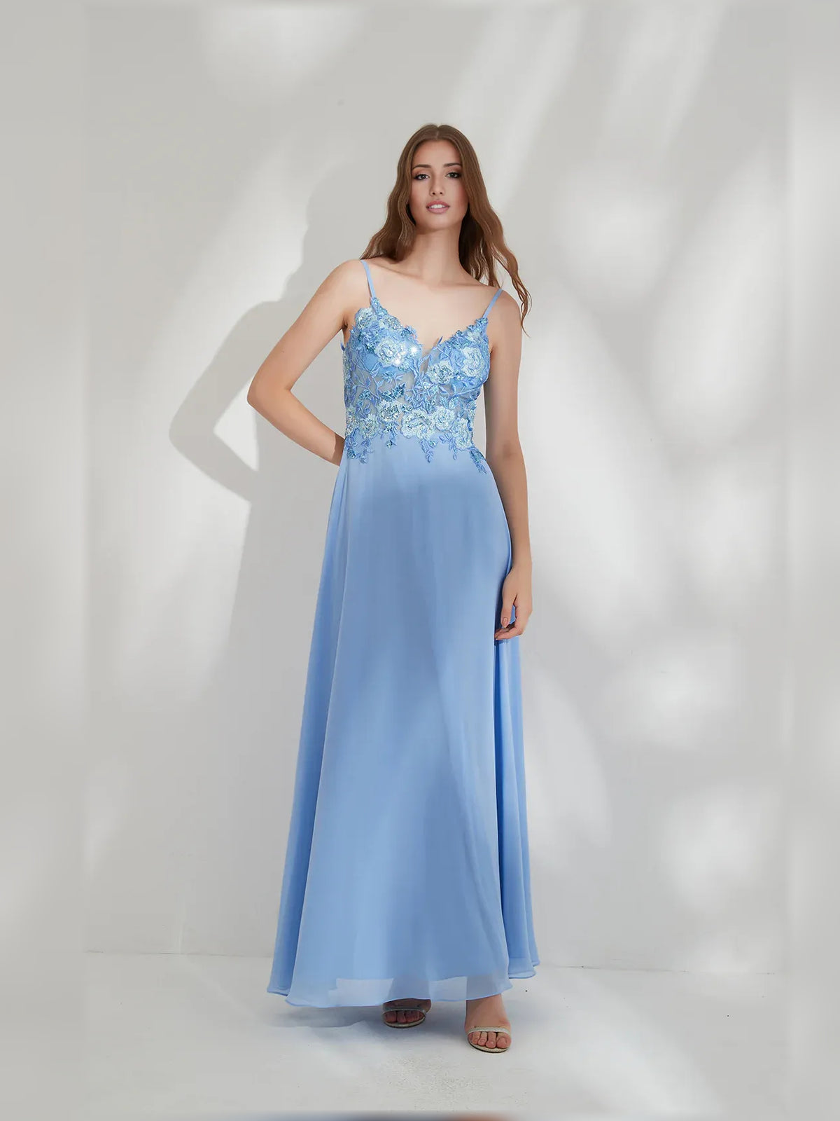 Blue a-line floor-length formal dress with V-neckline, full-length front view