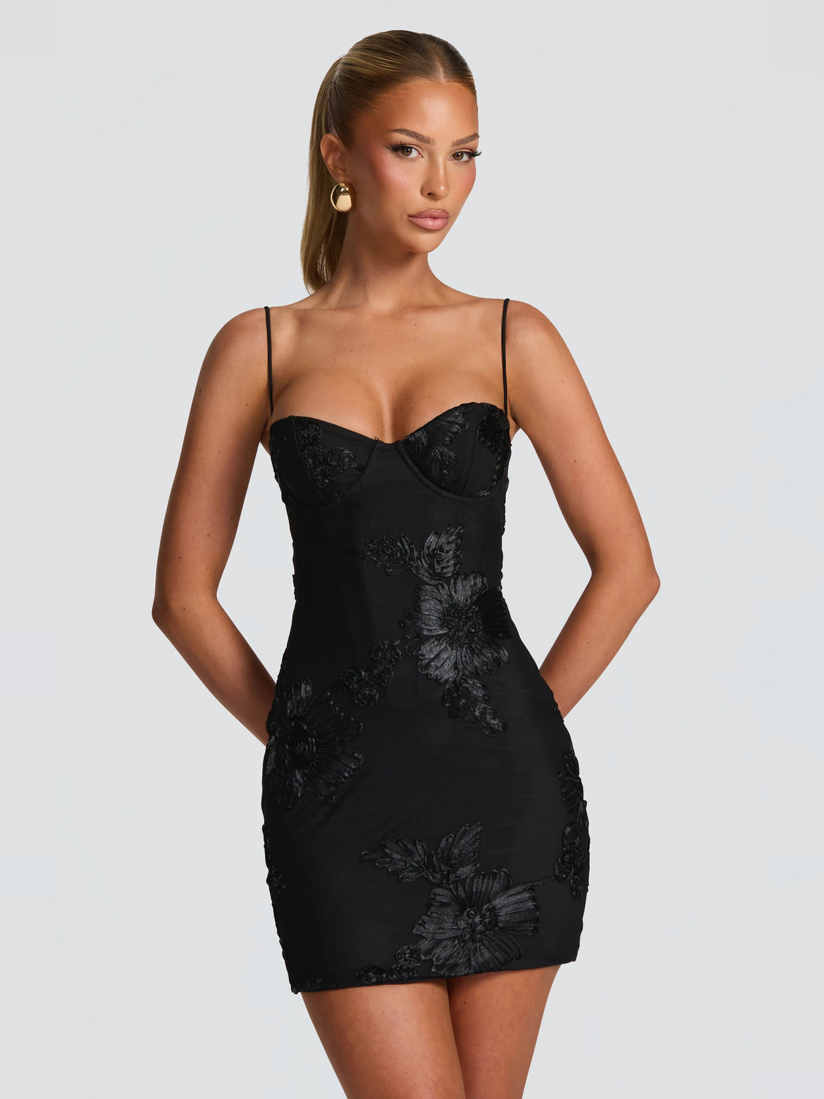 Black mini homecoming dress, front view showing the silhouette