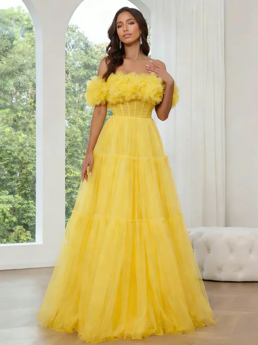 Yellow floor-length prom dress, front view showing the a-line silhouette