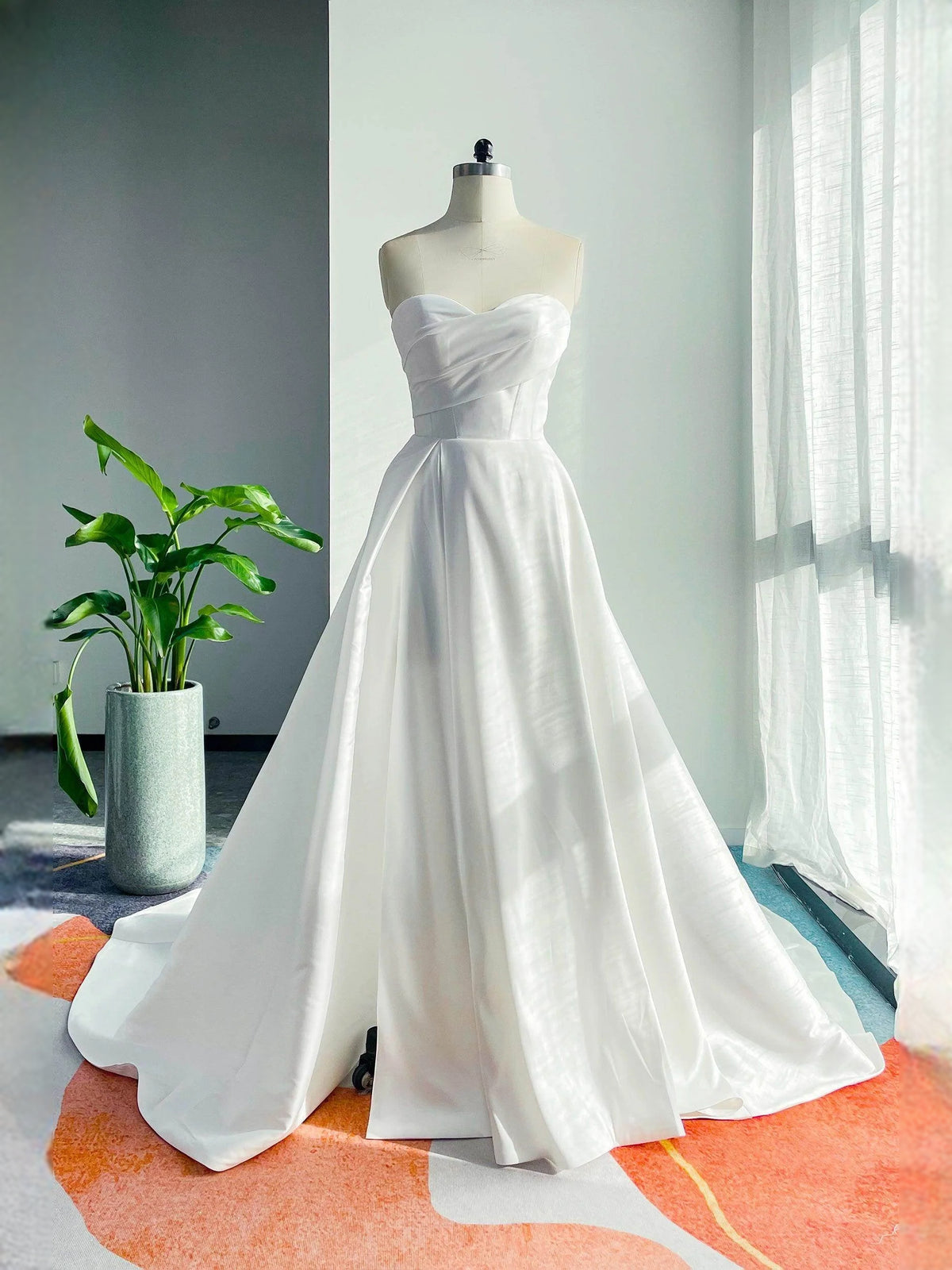 White floor-length wedding dress, front view showing the a-line silhouette