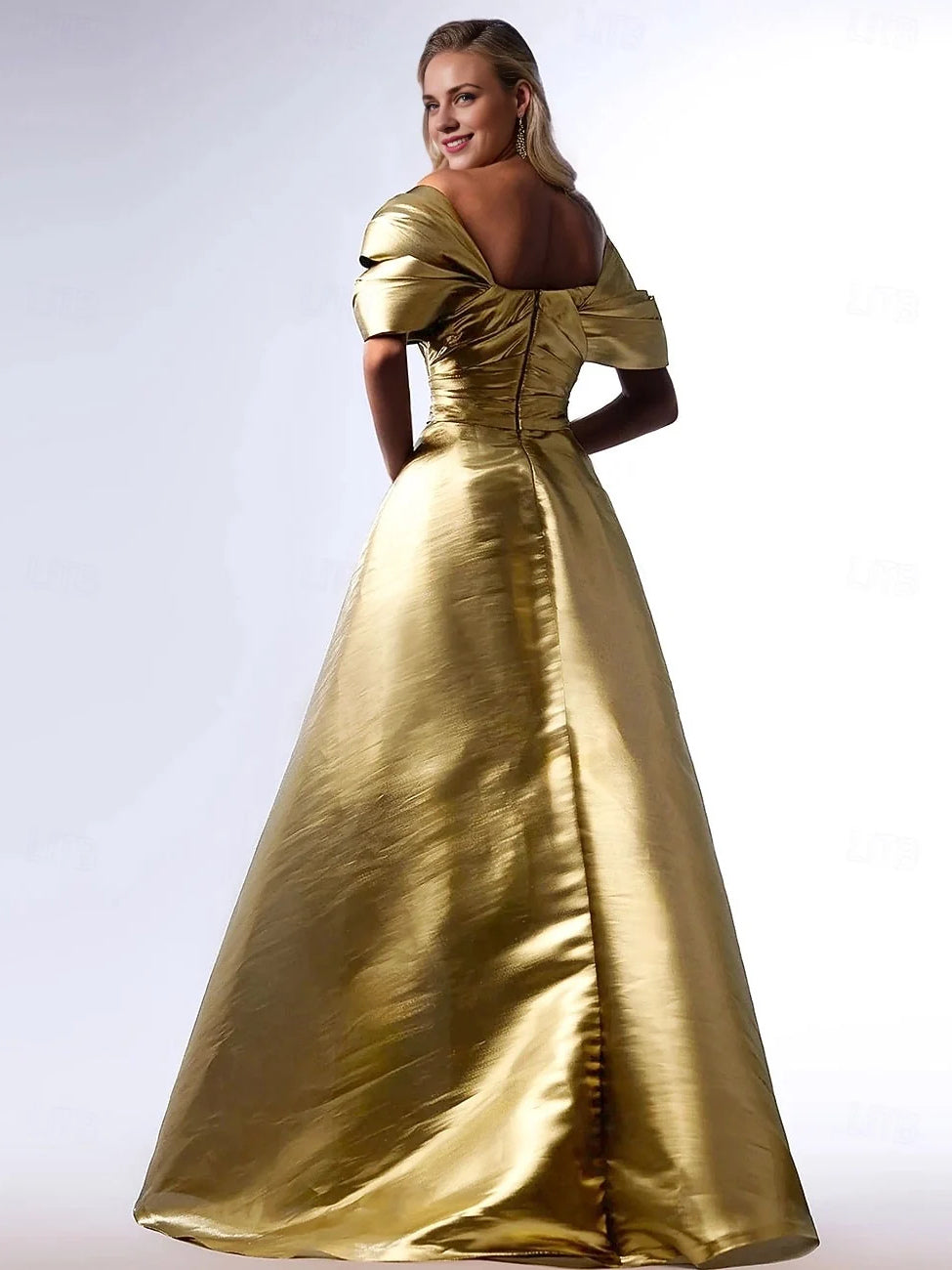 Gold maxi prom dress, front view showing the a-line silhouette