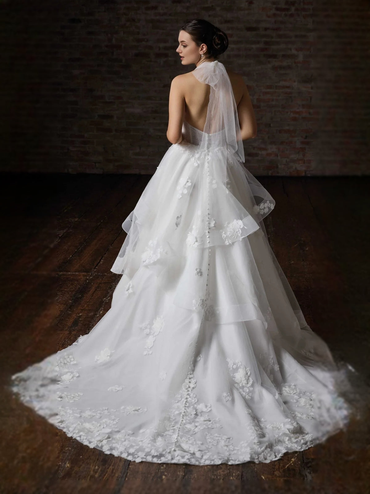 White floor-length wedding dress, front view showing the a-line silhouette
