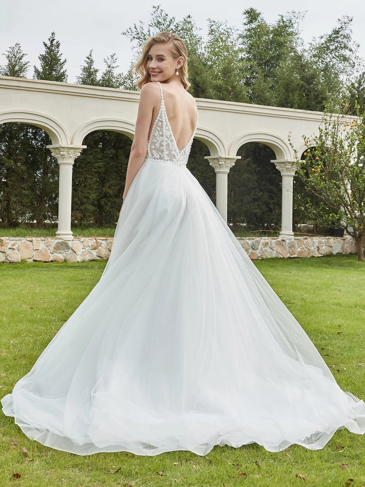 Ivory floor-length wedding dress, front view showing the a-line silhouette