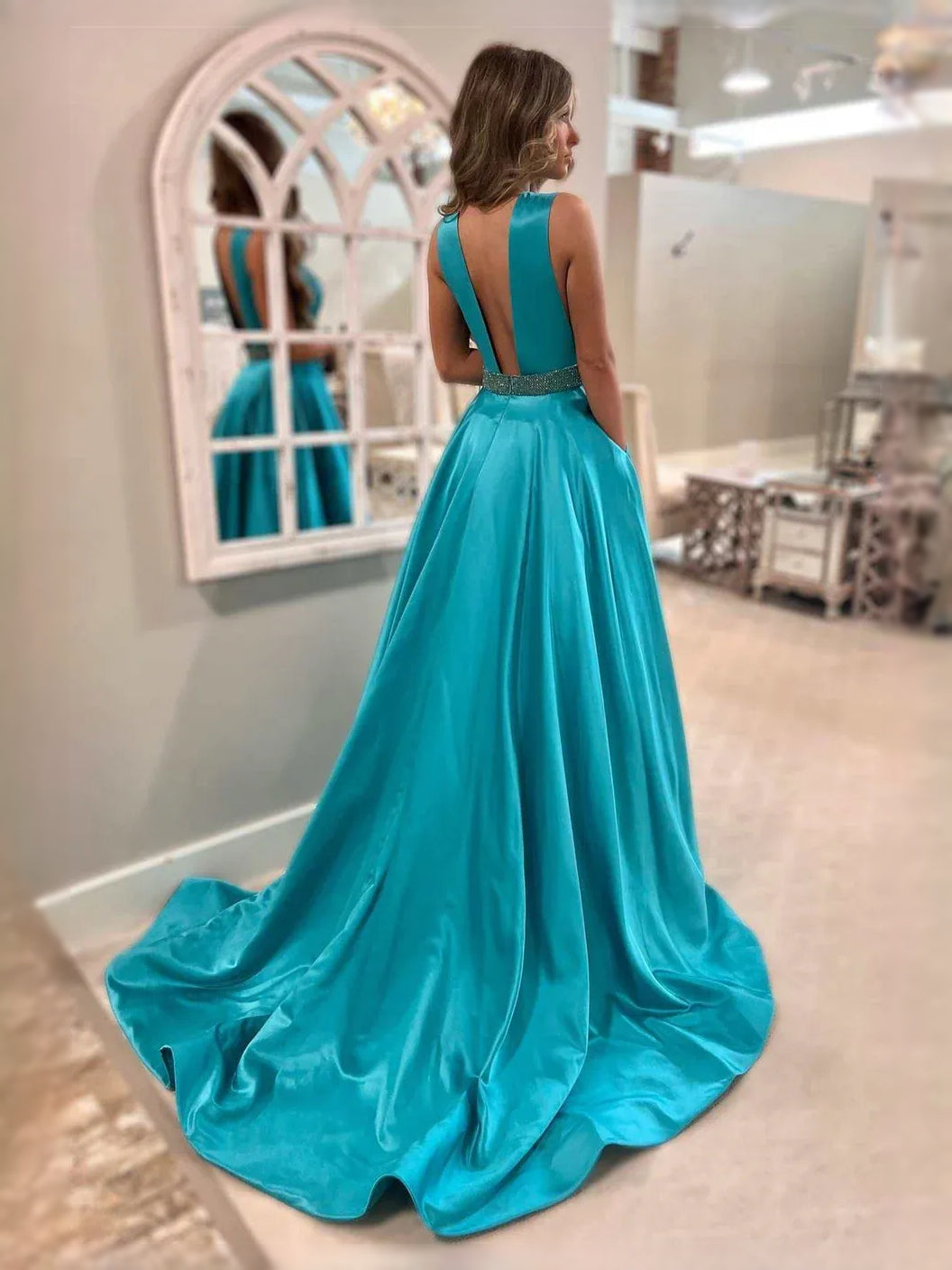 Turquoise maxi prom dress, front view showing the a-line silhouette