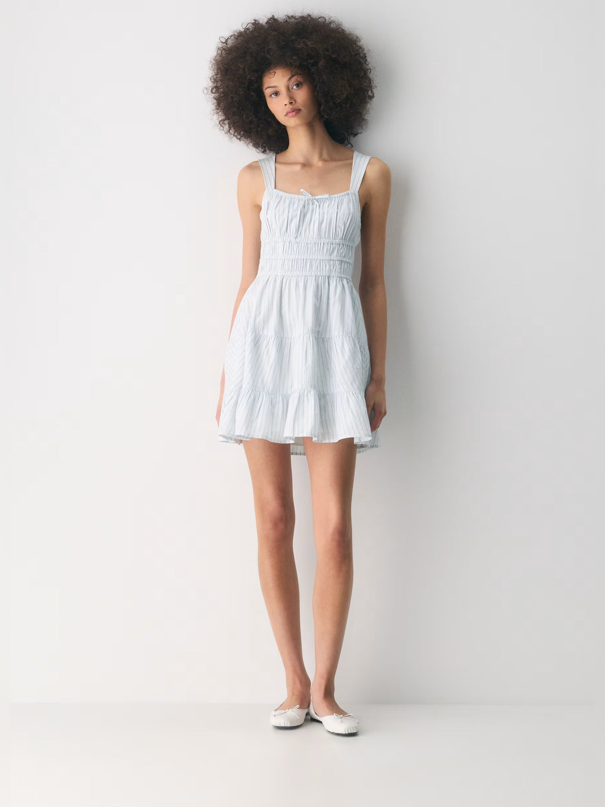 Orange mini homecoming dress, front view showing the silhouette