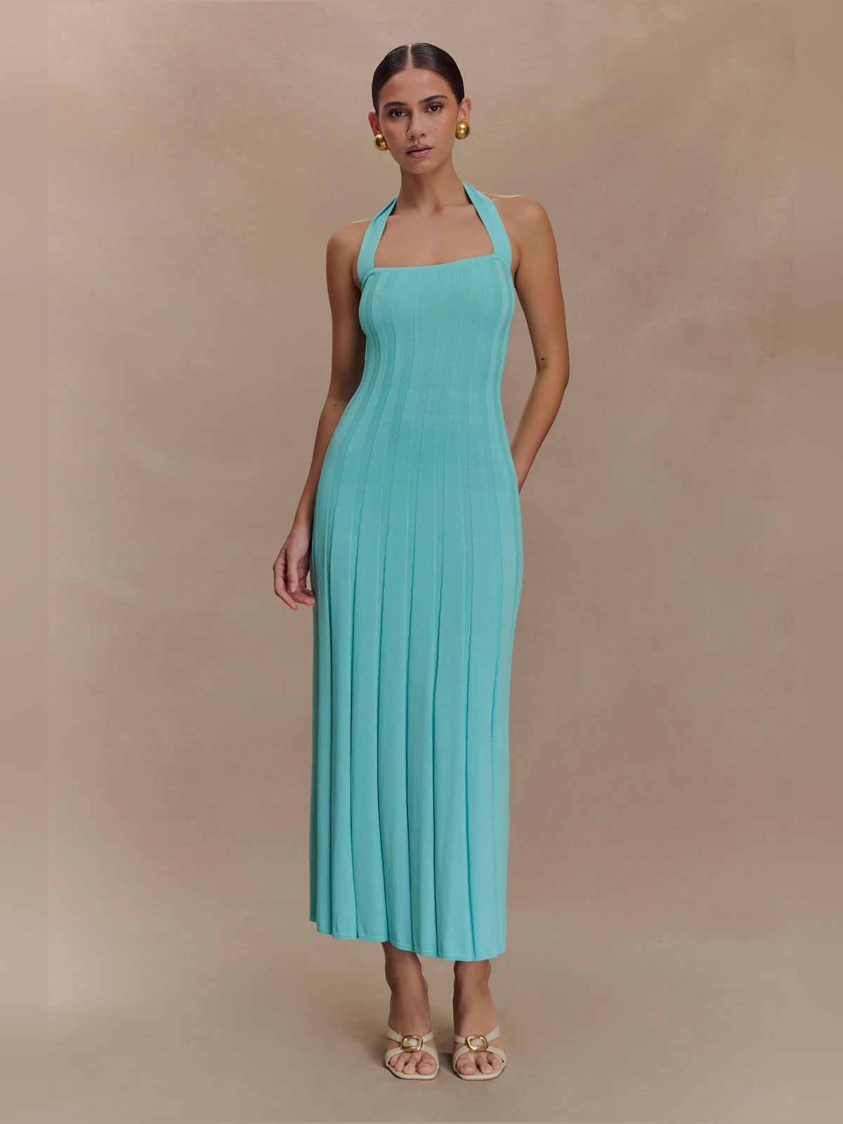 Blue midi formal dress with halter neckline, full-length front view
