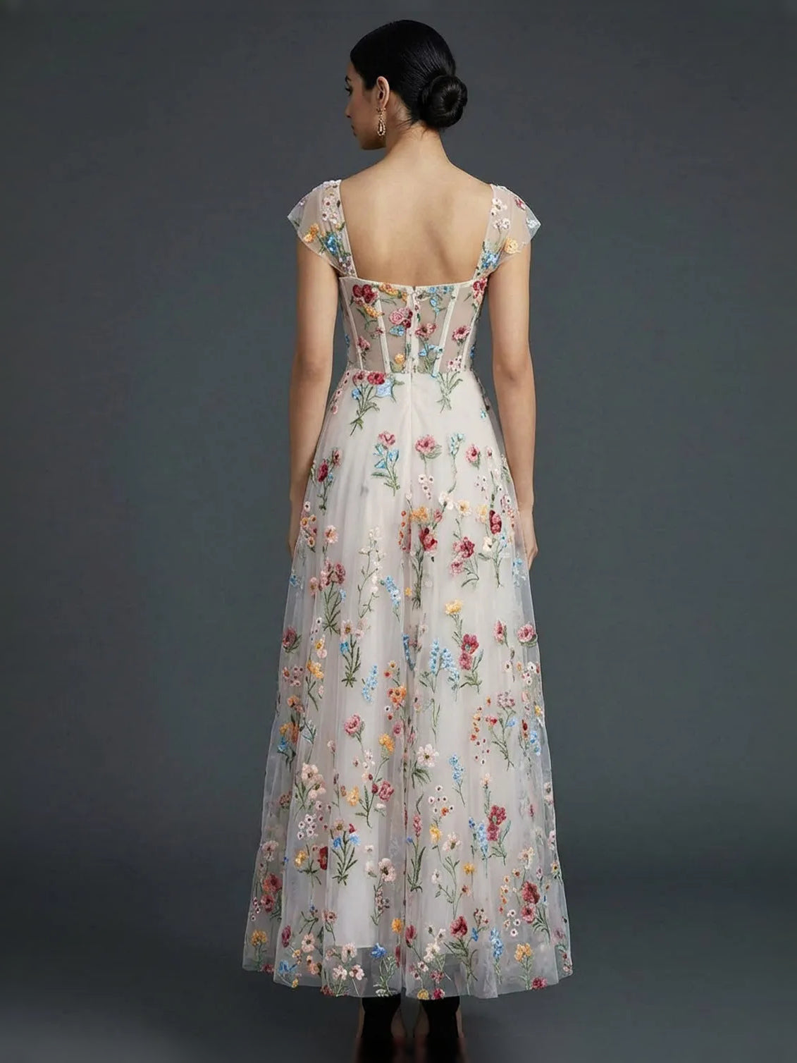 Floral tea-length prom dress, front view showing the a-line silhouette