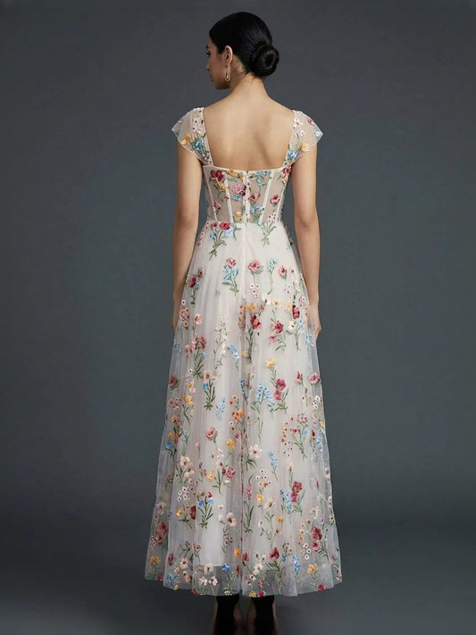 Floral tea-length prom dress, front view showing the a-line silhouette