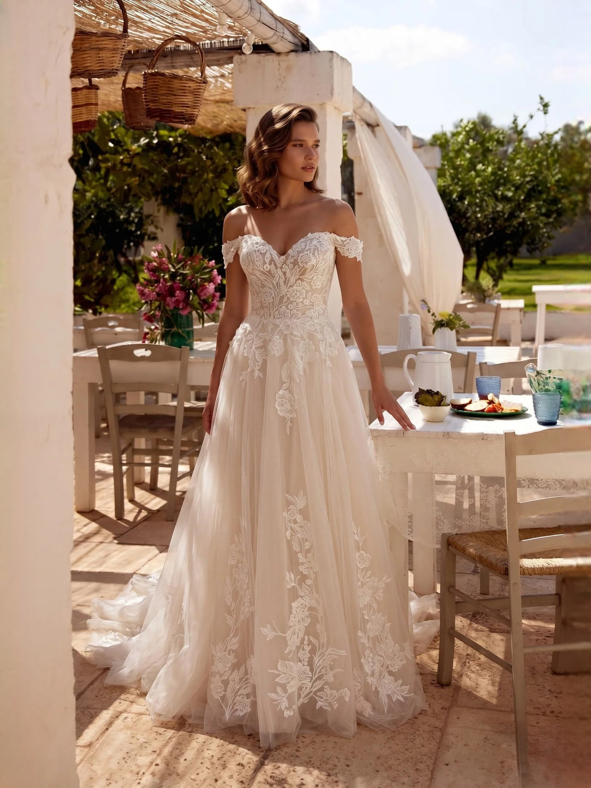 Ivory floor-length wedding dress, front view showing the a-line silhouette