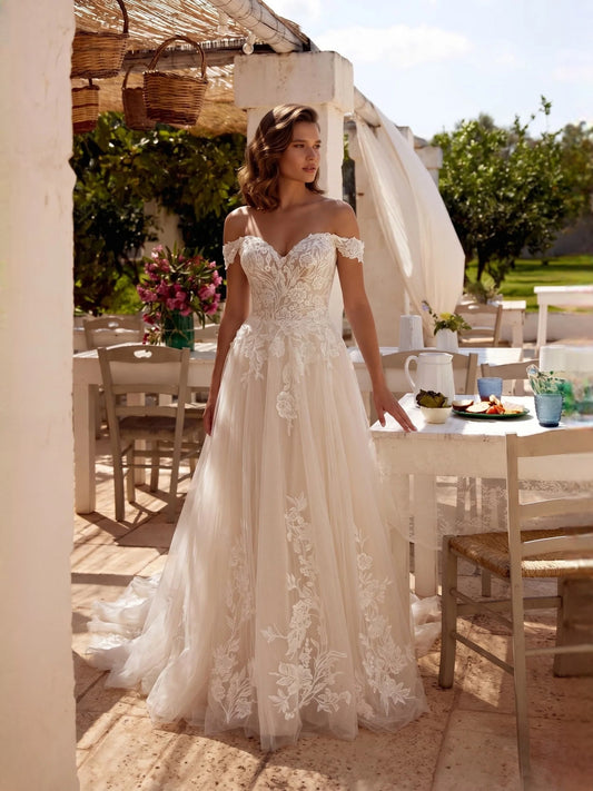 Ivory floor-length wedding dress, front view showing the a-line silhouette