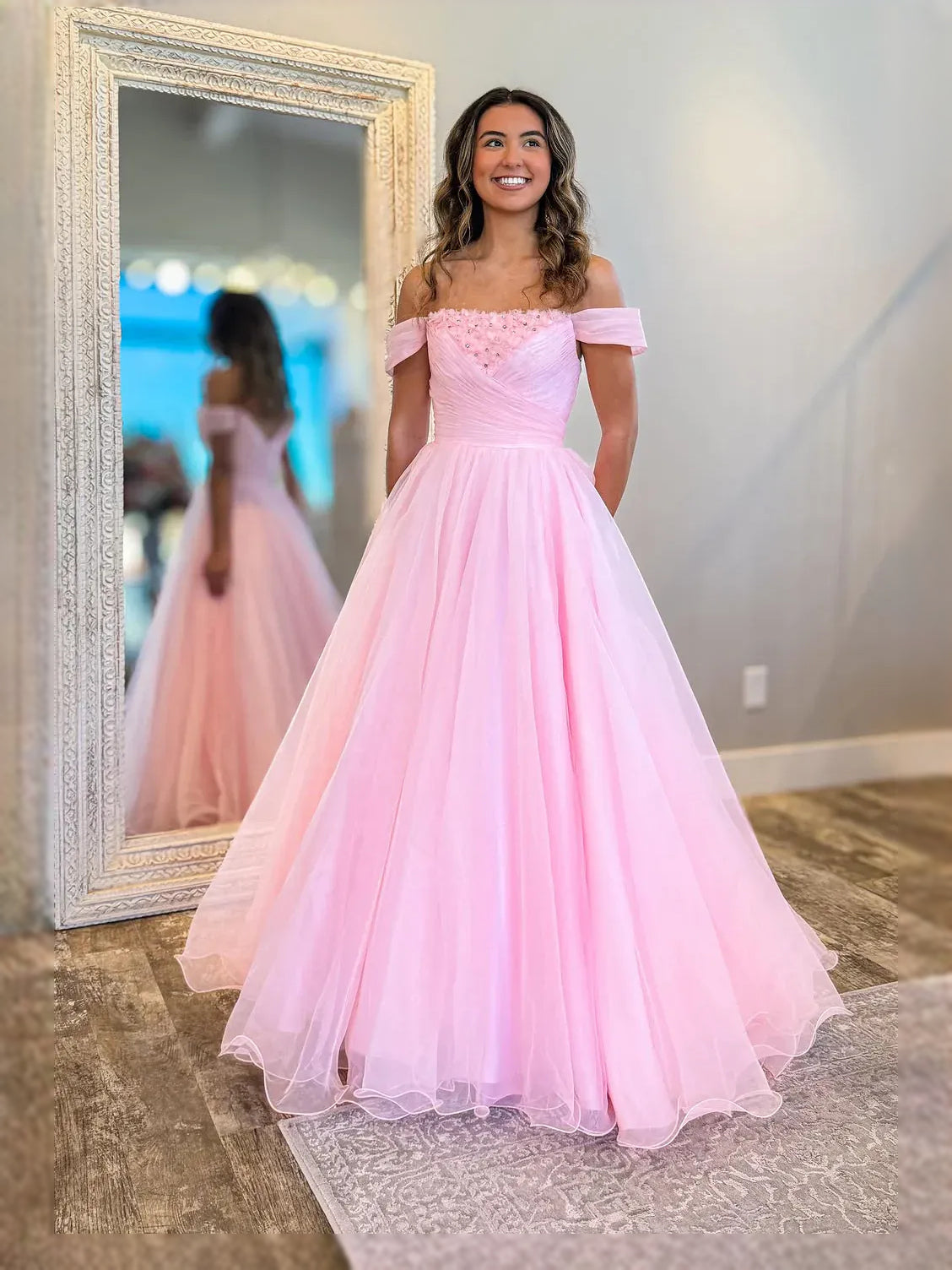 Pink floor-length prom dress, front view showing the a-line silhouette