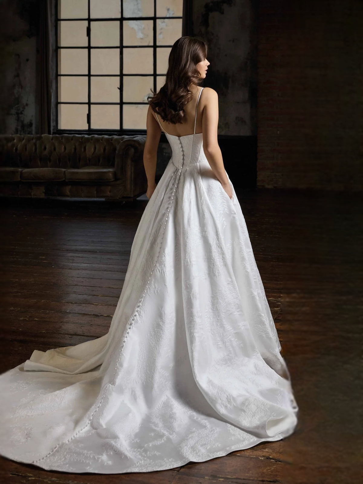 Ivory floor-length wedding dress, front view showing the ball-gown silhouette