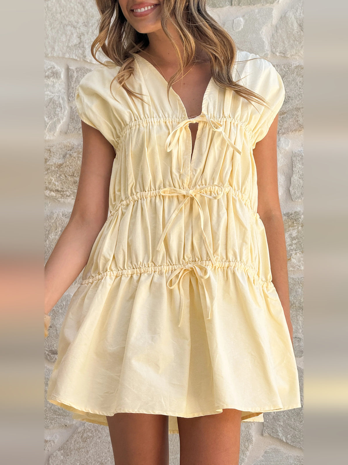 Yellow mini homecoming dress, front view showing the silhouette